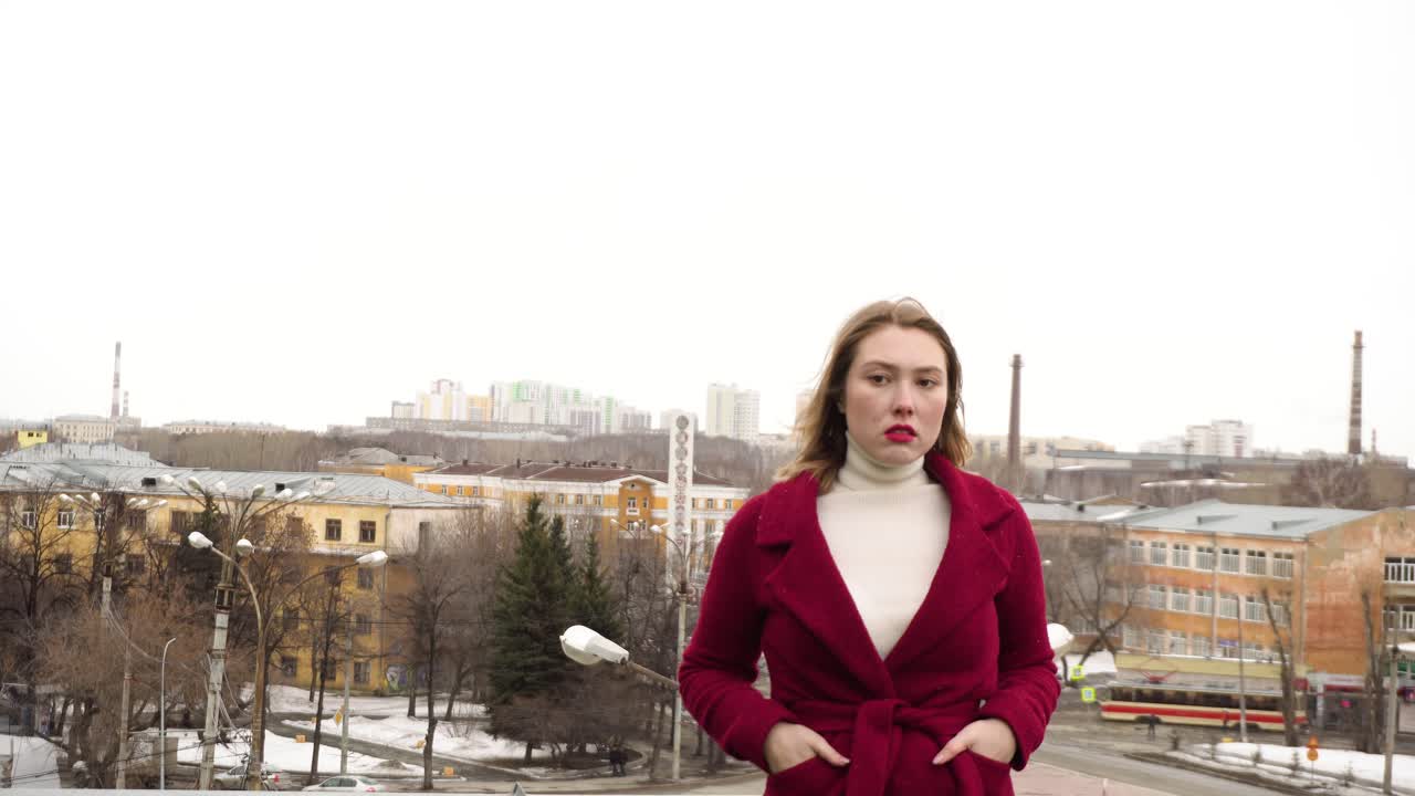 Woman in a Red Coat in a City
