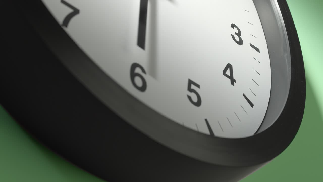 Clock Face on Light Green Wall in Time Lapse