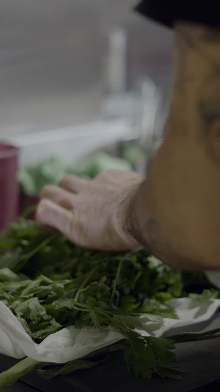 Hands Sorting Fresh Green Herbs