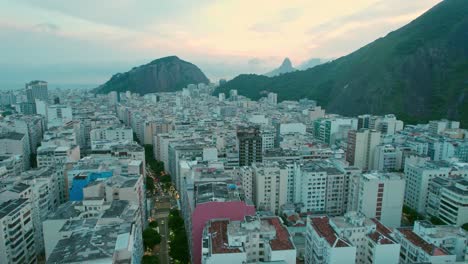 copacabana neighborhood aerial view rio de janeiro city, brazil, arpoador rock in golden blue sunset skyline