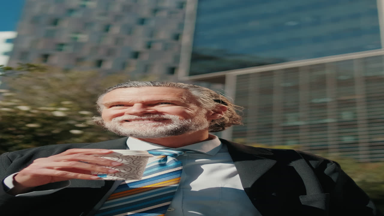 Businessman Enjoys Coffee Break in the City