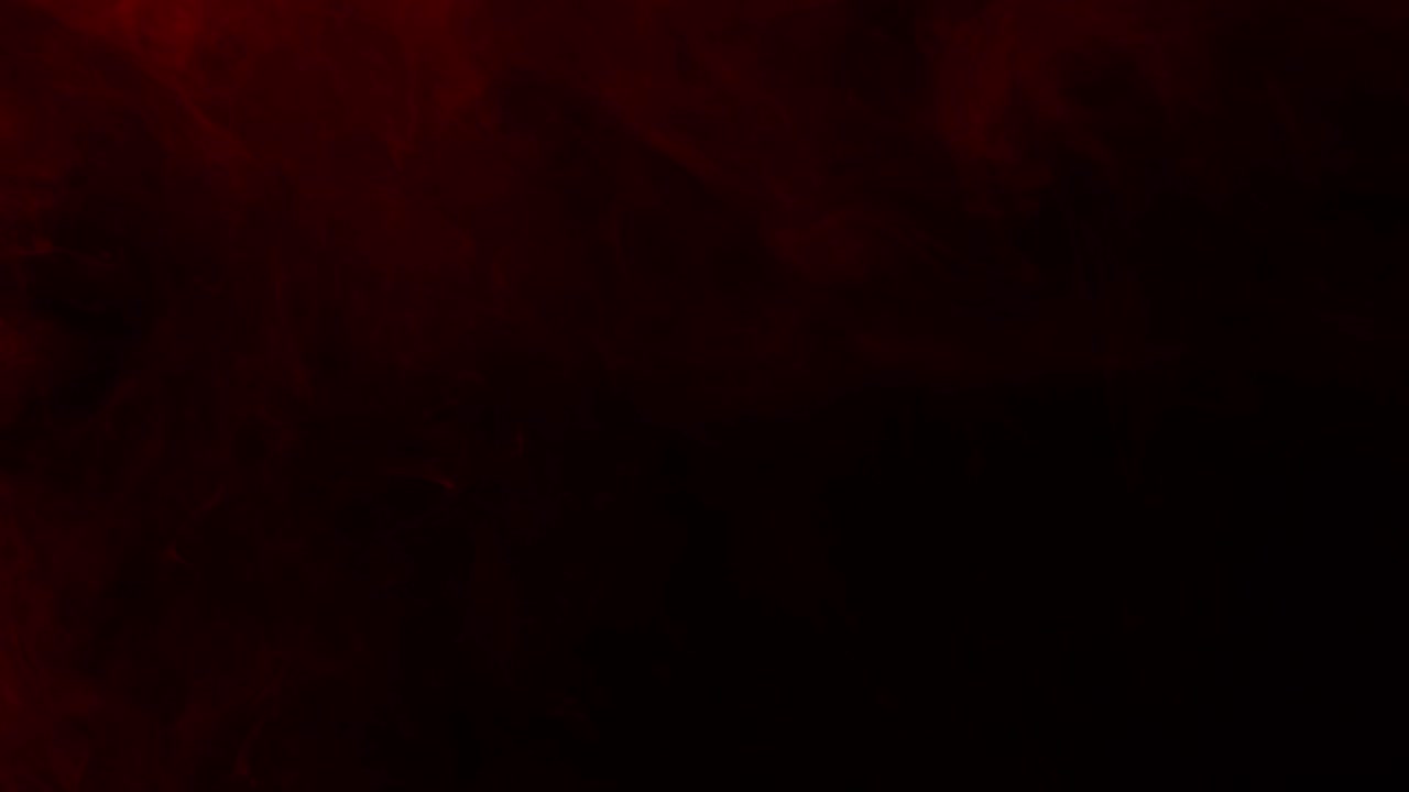Subtle and soft red fog or smoke drifts slowly across a dark screen. Atmospheric overlay for creating a moody, horror, or dramatic ambiance,vfx