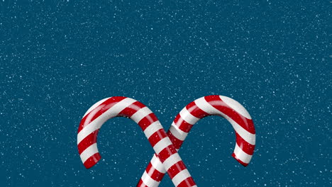 animation of snow falling and candy canes on blue background