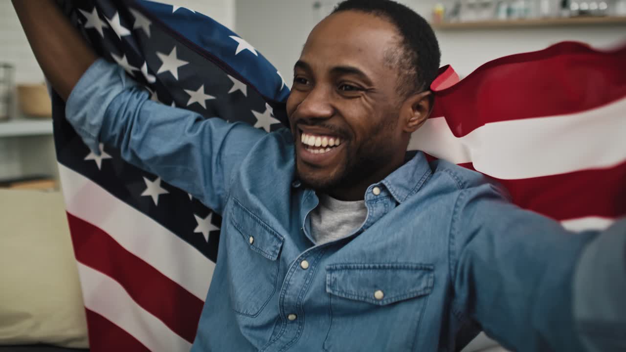 Video of very happy man watching TV of USA election