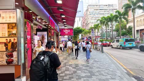 people walking along a vibrant city street