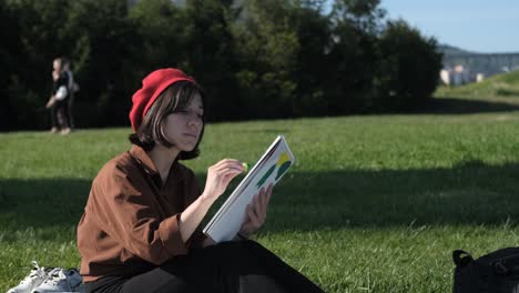 woman drawing on grass