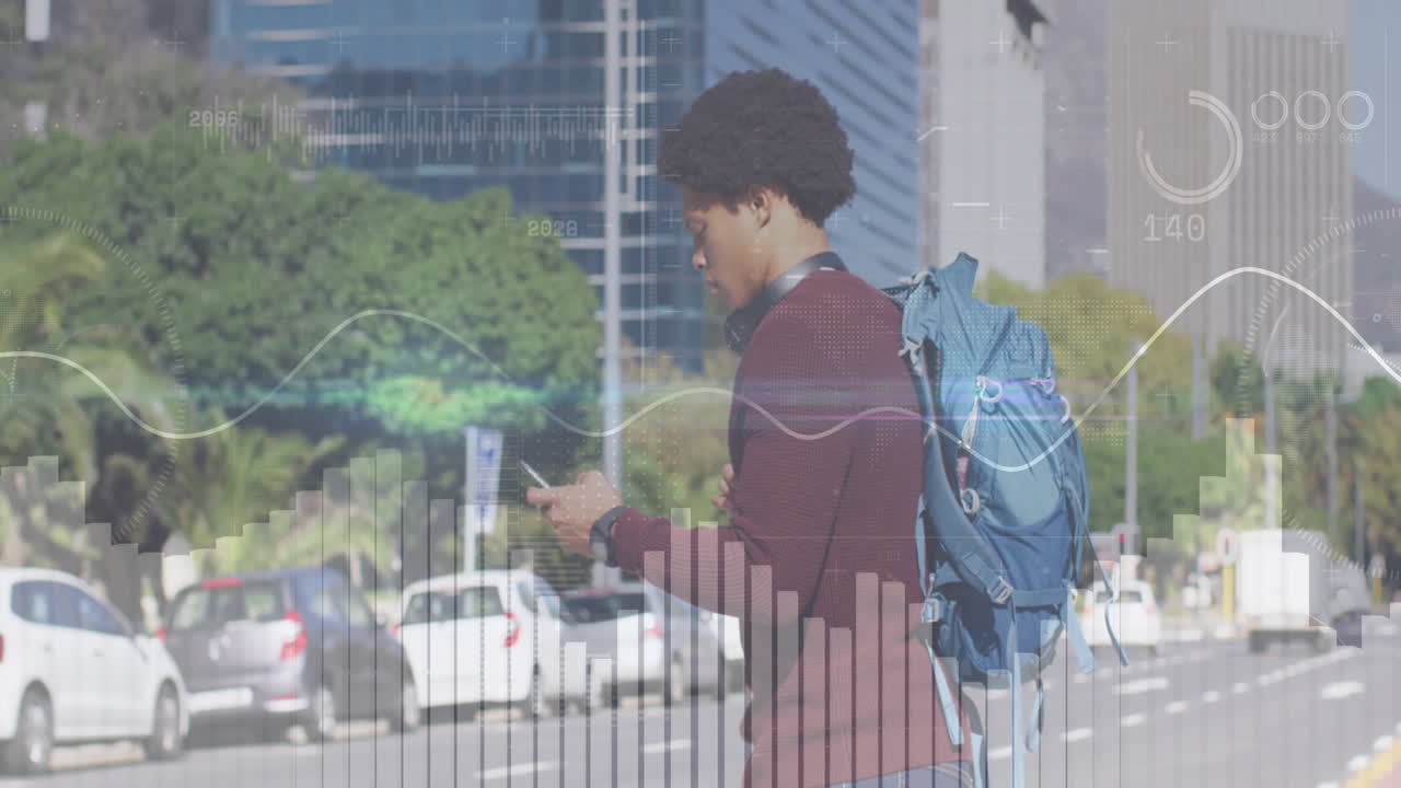 Animation of statistical data processing over african american man using smartphone crossing street