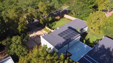 Drone-Aerial-View-of-Solar-Panels-on-Modern-Eco-friendly-Home