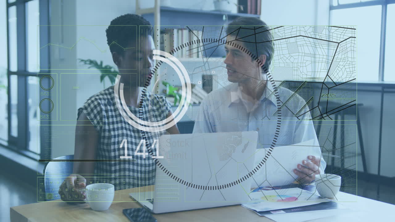 Two coworkers reviewing business charts at desk, displaying floating graphs and progress indicator