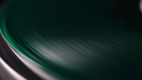 Green-Vinyl-Record-Spinning-on-Gramophone-Turntable,-Macro-Close-Up