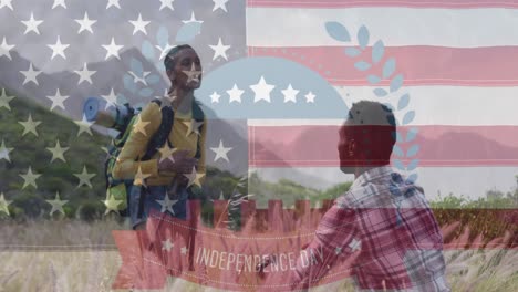 Animation-of-independence-day-text-over-smiling-diverse-couple-high-fiving-and-hiking