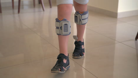 therapy with functional electrical stimulation kid wearing foot drop system