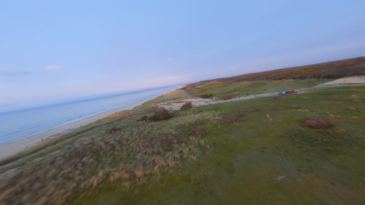 Fast drone shot starting above a World War Two bunker in the dunes of Oostkapelle