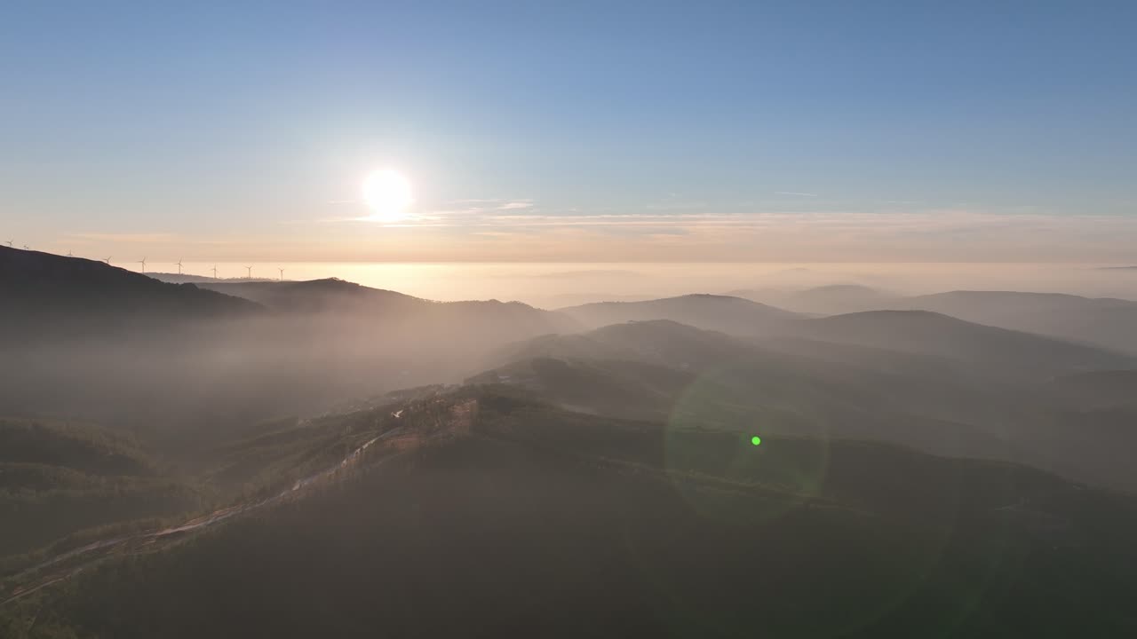 Sunset in the countryside of Portugal. Forest covered hills and light fog at dusk. Coimbra district - Cantoneiros and Cerdeira.