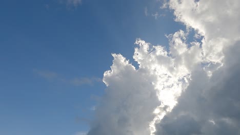 bright sun light ray n sunbeams on white cloud blue sky