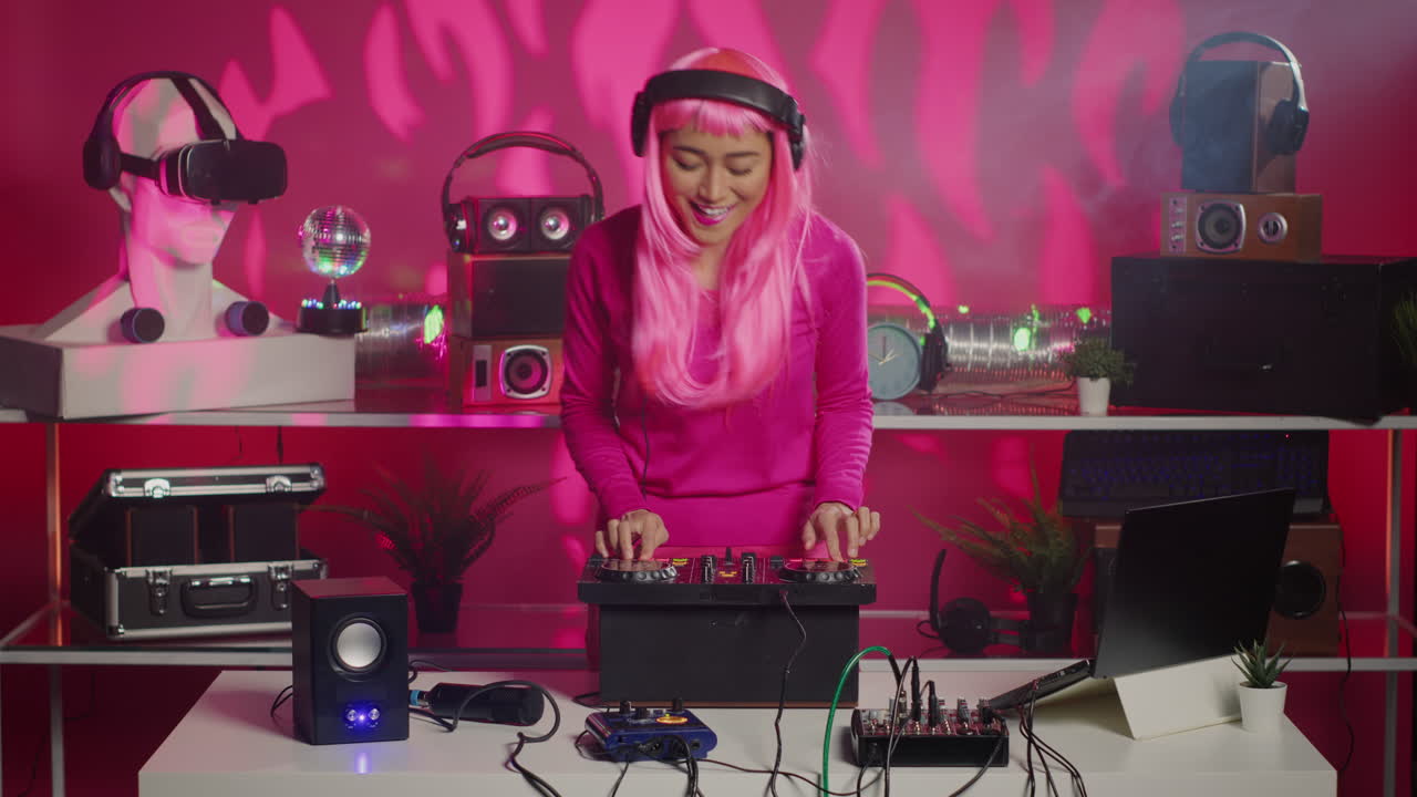 Woman with Pink Wig DJing with a Turntable and Sound System