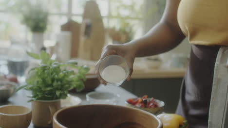 adding salt while cooking food