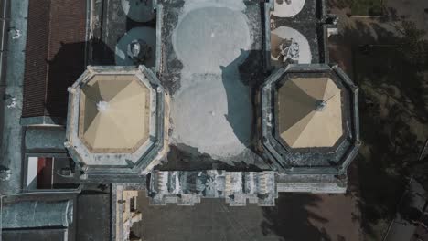 Drone-aerial-view-of-la-merced-church---landmark-in-Antigua-Guatemala,-Central-america