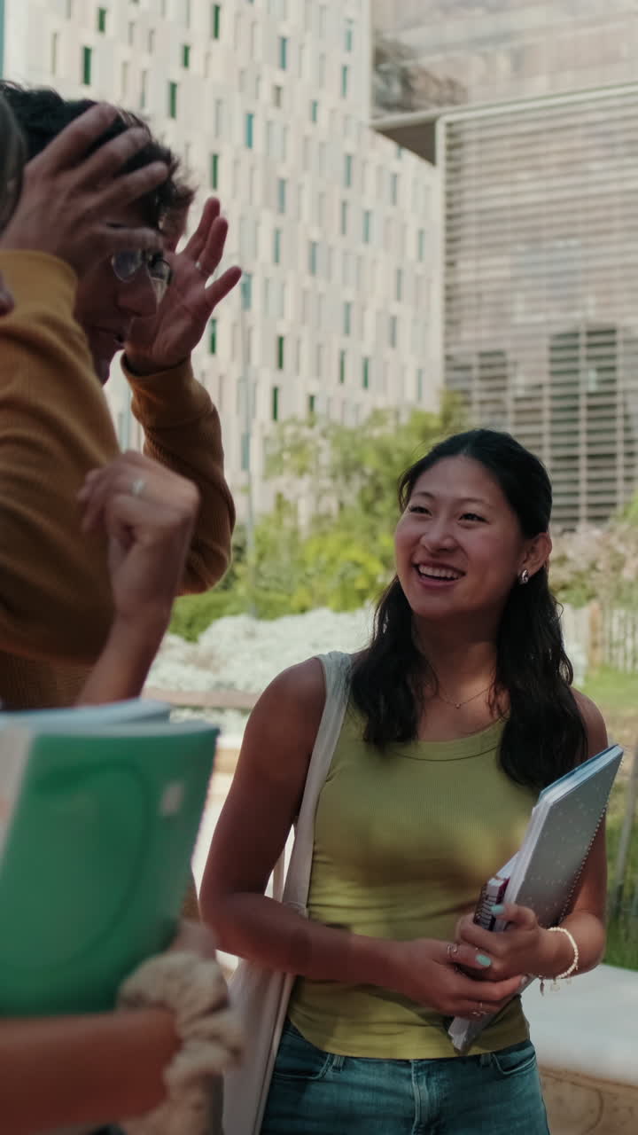 Millennial group of happy students, young friends standing in the street