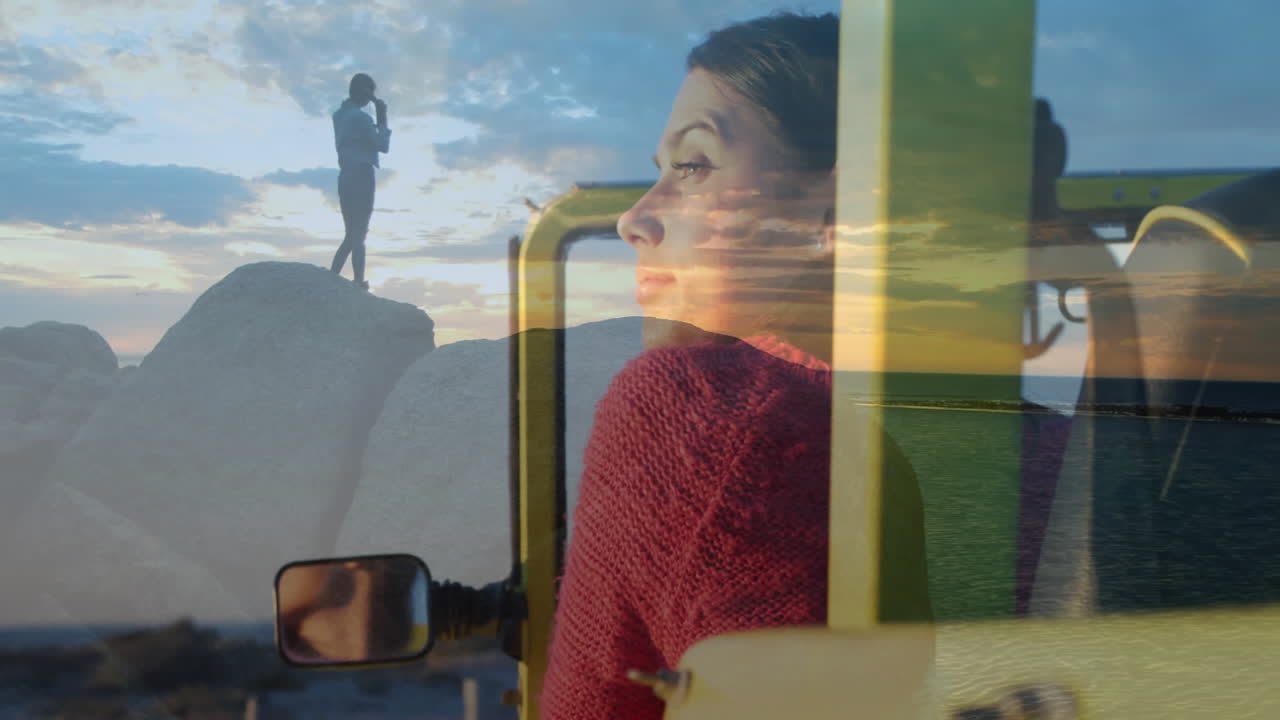In car, woman in red sweater gazing out window at animation nearby