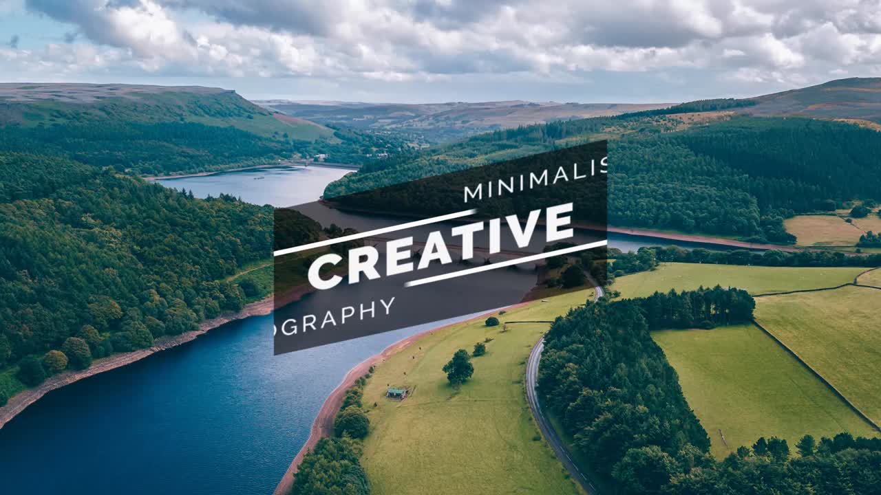 Aerial View of a Scenic Valley with River and Mountains