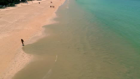 4K-Cinematic-nature-drone-footage-of-a-panoramic-aerial-view-of-the-beautiful-beaches-and-mountains-on-the-island-of-Koh-Lanta-in-Krabi,-South-Thailand,on-a-sunny-day