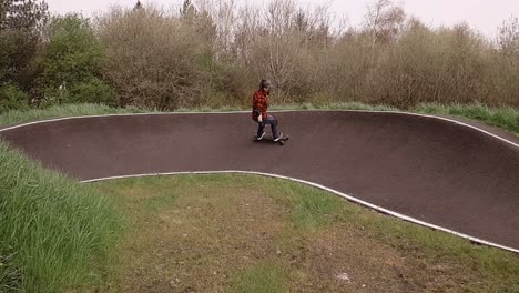 Eboarding-footage-around-a-BMX-pump-track