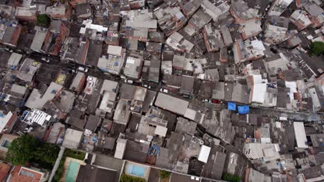 Aerial-view-over-a-middle-class-area-and-a-poor-community-in-Sao-Paulo,-Brazil