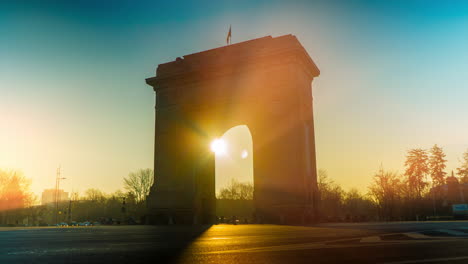 sunrise at the arch of triumph in bucharest, romania
