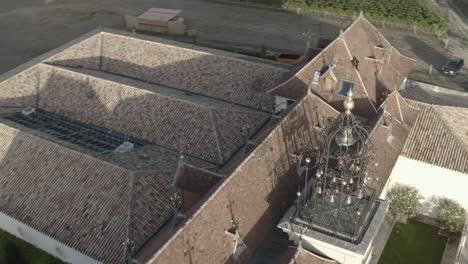 château angelus winery, decorated roof and bell tower, france. aerial drone orbiting