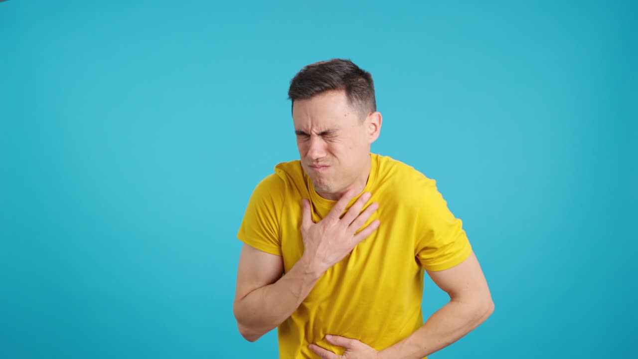 Man experiencing nausea and stomach pain