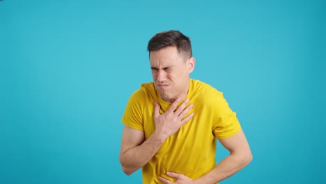 man experiencing nausea and stomach pain