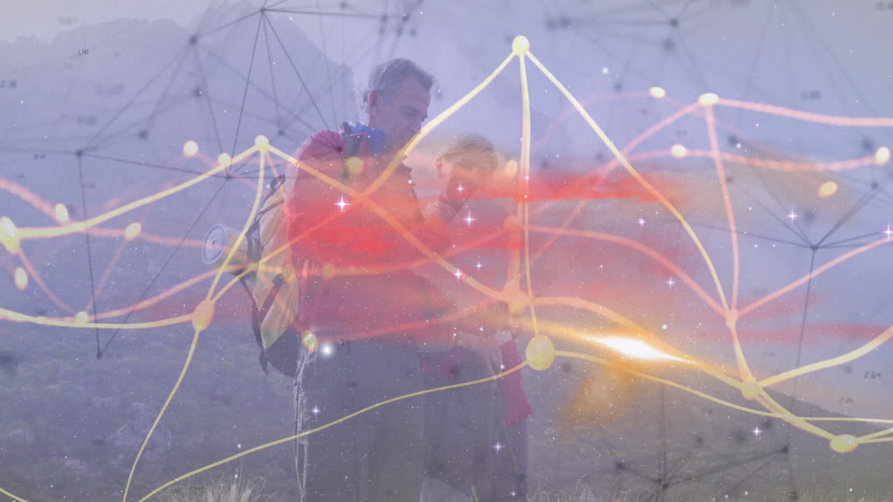 Hiking couple navigating mountain slope, with glowing technology network lines and data trails