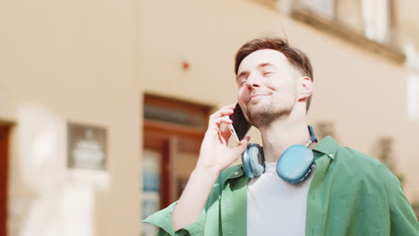 man tourist having remote conversation communicate speaking by smartphone with friend good news