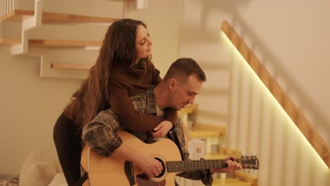 a loving couple is spending time at home.