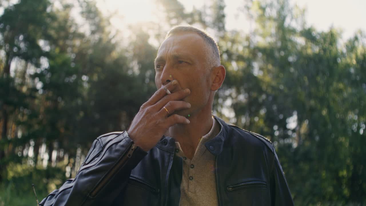 Man in leather jacket outdoors
