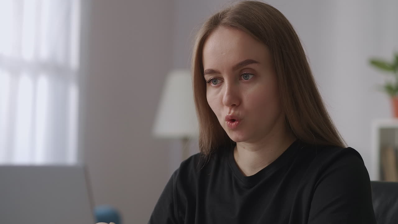 female professional and specialist is communicating by online video chat at distant meeting with colleagues and partners closeup portrait in home office