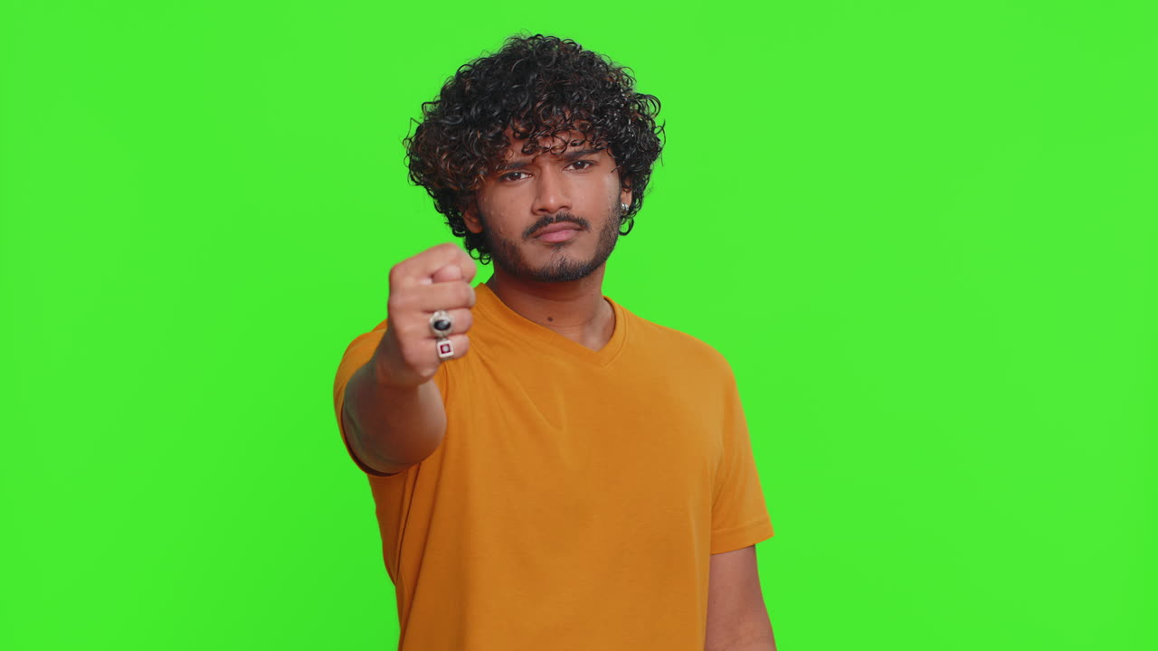 Quarrel indian man showing fig negative gesture rapacious avaricious acquisitive refusal sign