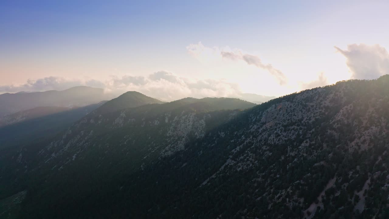 Aerial Footage Of Sun Hiding Behind Mountain Peak, Kemer, Turkey