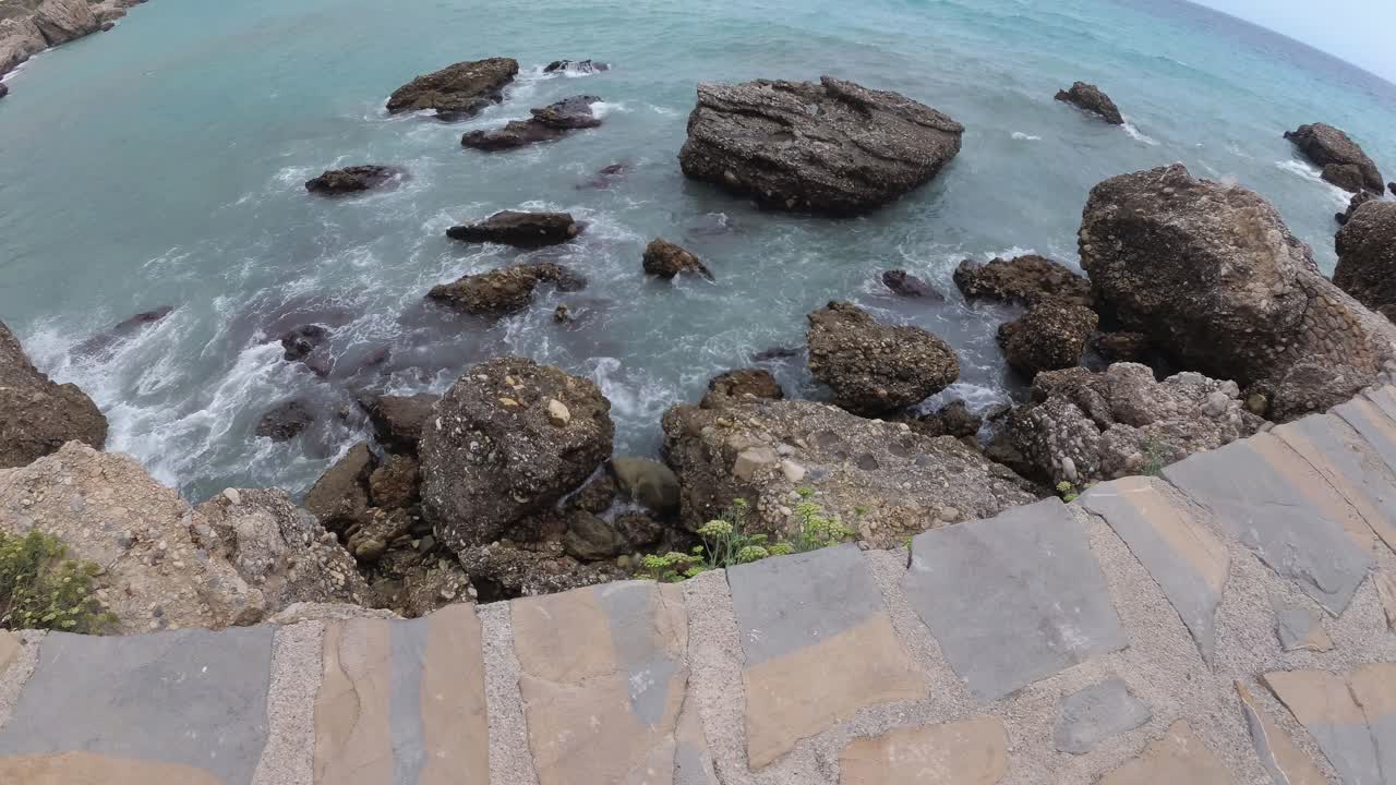 playa españa malaga nerja en un día nublado de verano usando un dron y una cámara de acción estabilizada-37