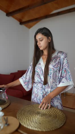 woman making tea in her home