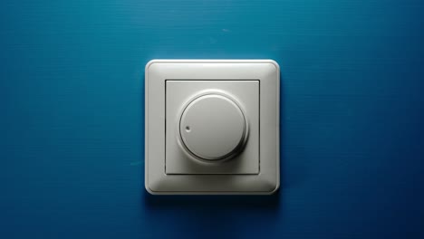 dimmer button turning on a blue wall - stop motion