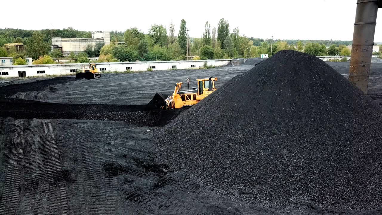Aerial view of big pile of coal. Extractive industry, anthracite.