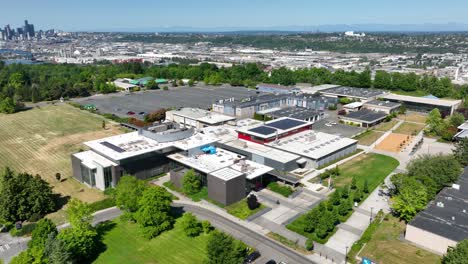 establishing drone shot of south seattle college's campus on a bright sunny day