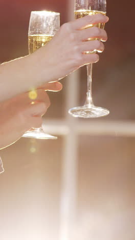 group of businesspeople toasting glasses of champagne