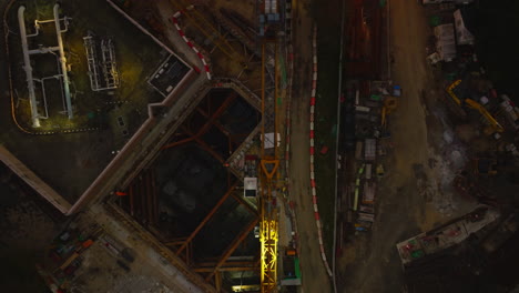 Stunning-drone-shot-over-a-crane-in-a-construction-site-in-a-city