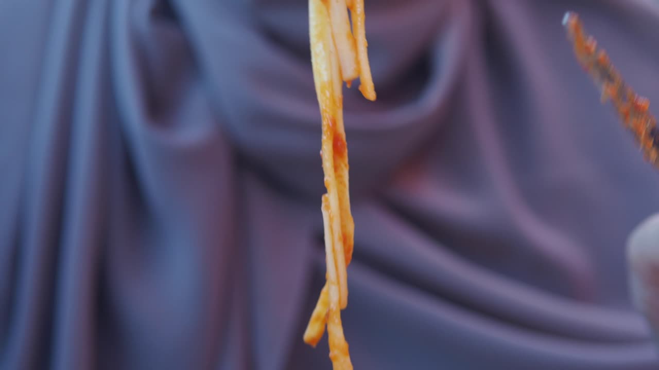 Eating Pasta with Tomato Sauce