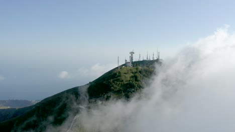 Aerial-view-of-a-mountain-through-the-clouds-in-Italy