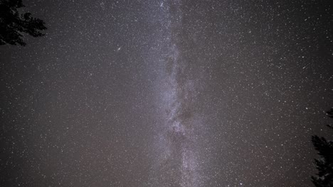 Milky-Way-bright-stars,-and-satellite-trails-in-the-dark-night-sky