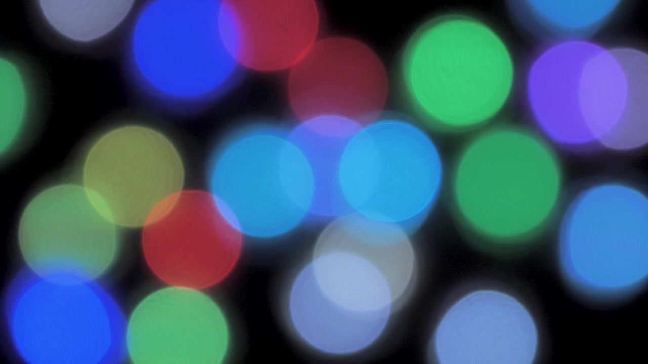 Bokeh slow moving christmas lights abstract background